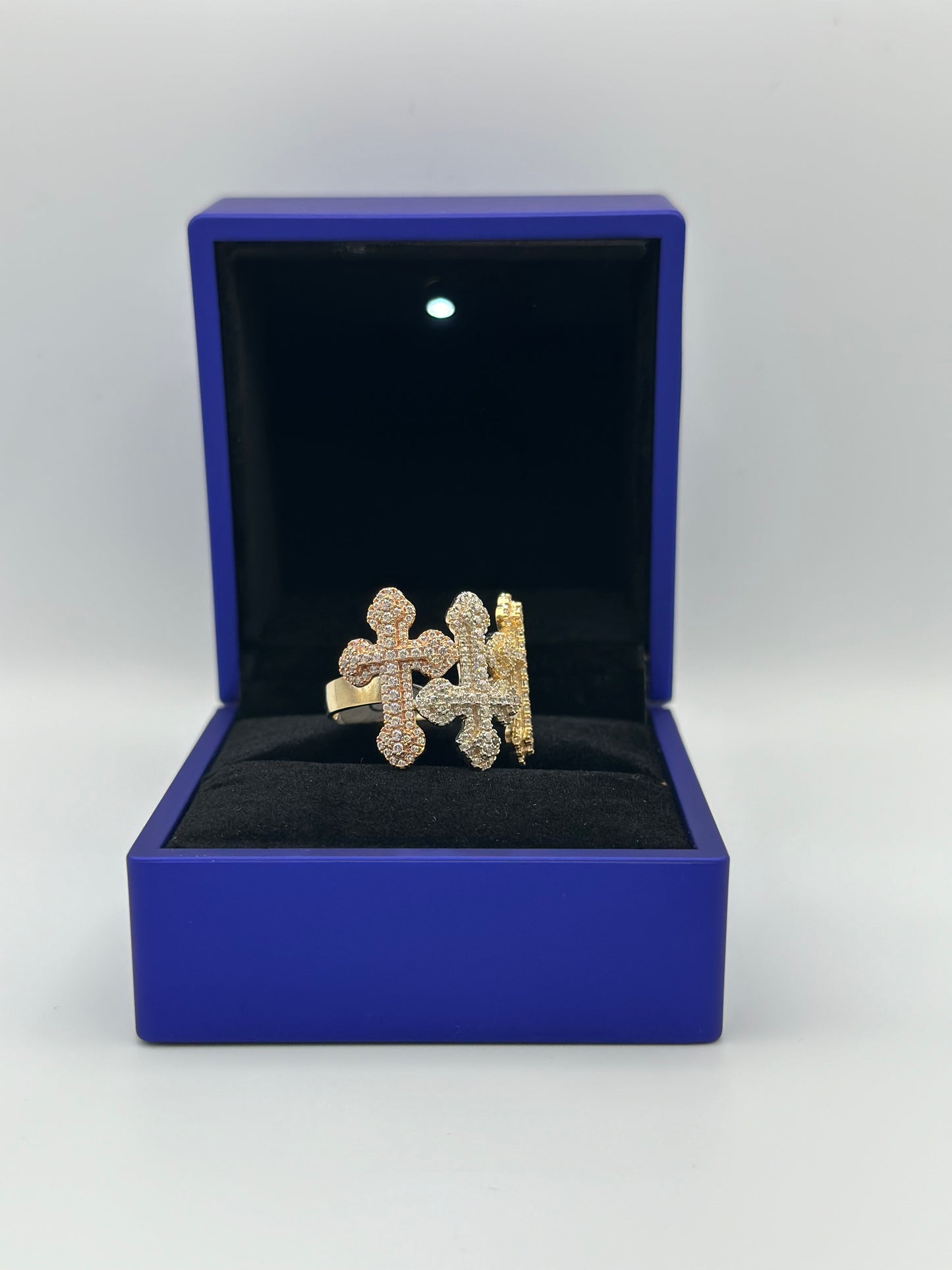 Cross design ring with three golds