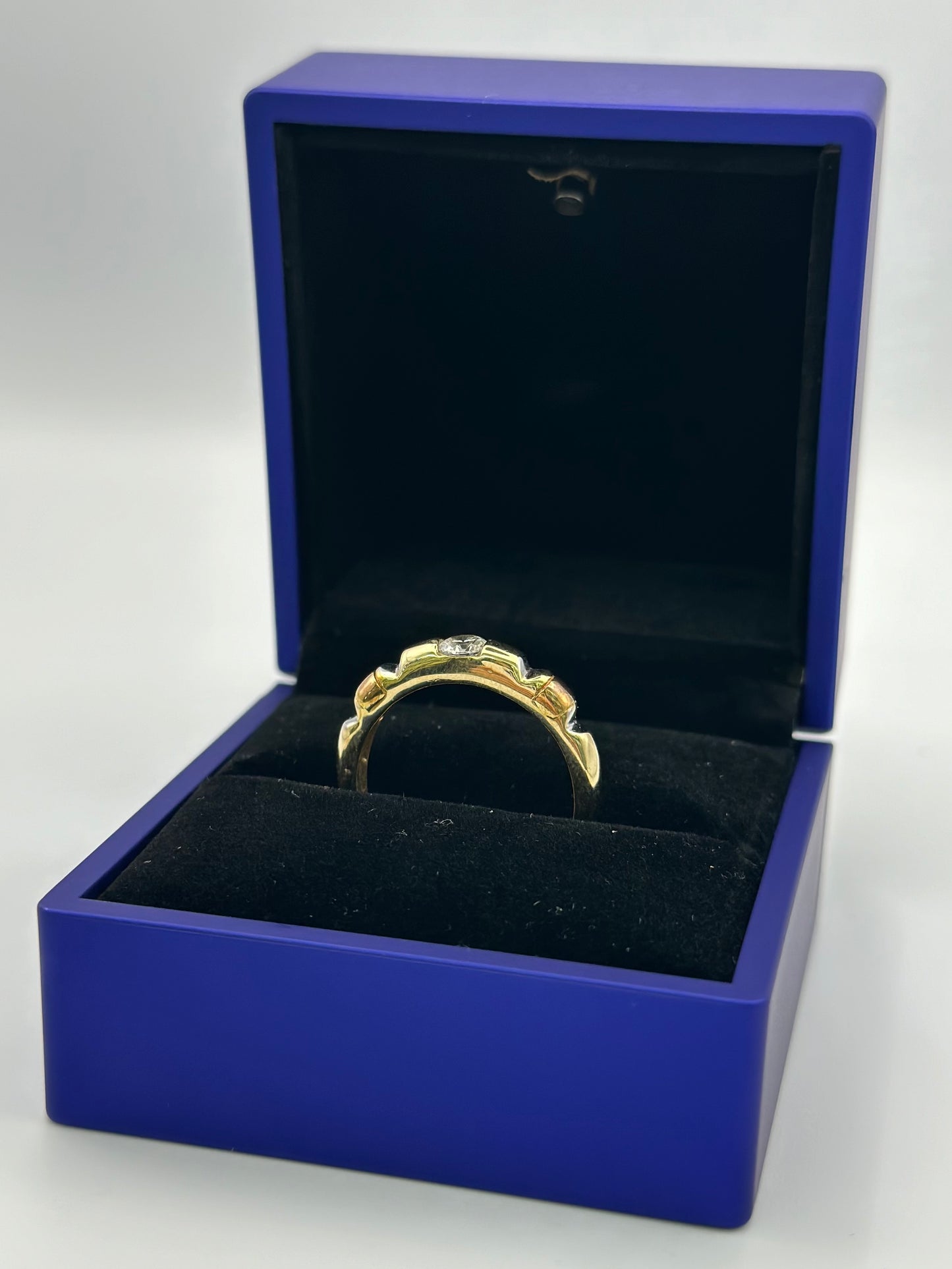 Trio of three-tone wedding rings. 12