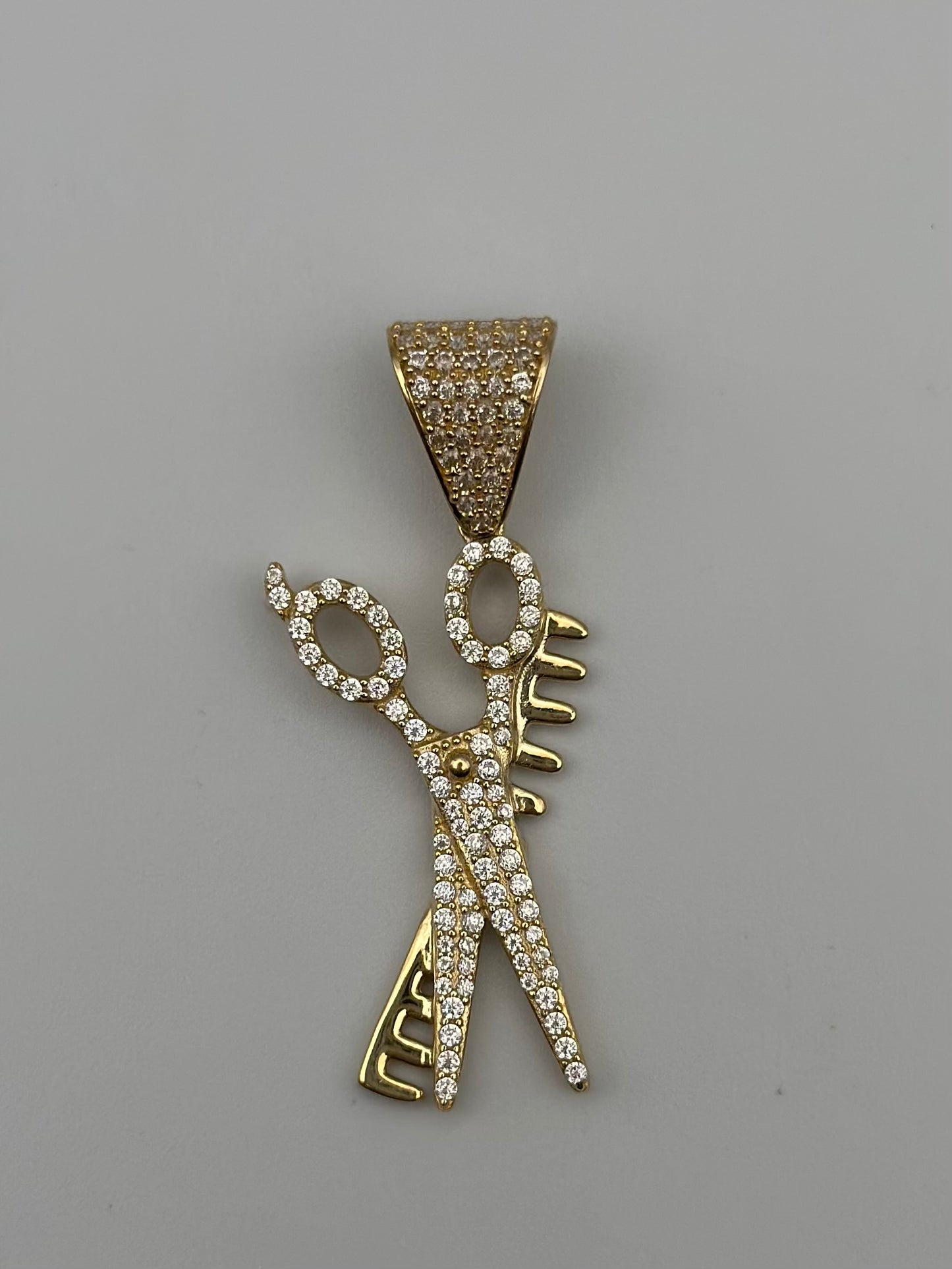 Scissor and comb pendant