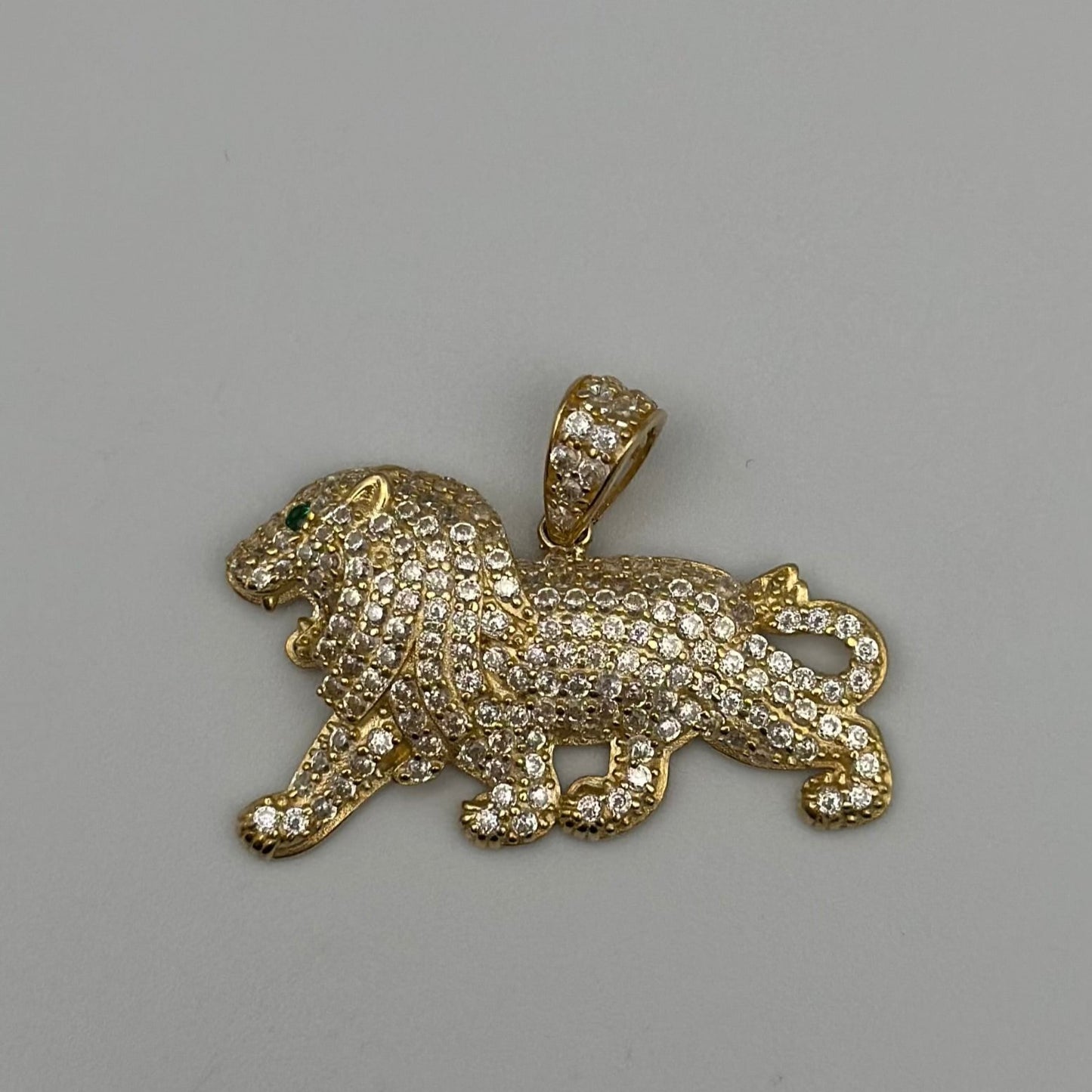 Lion pendant with zirconia .