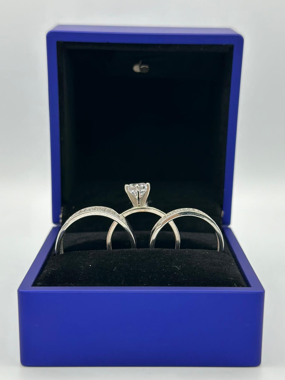 White trio of wedding rings.