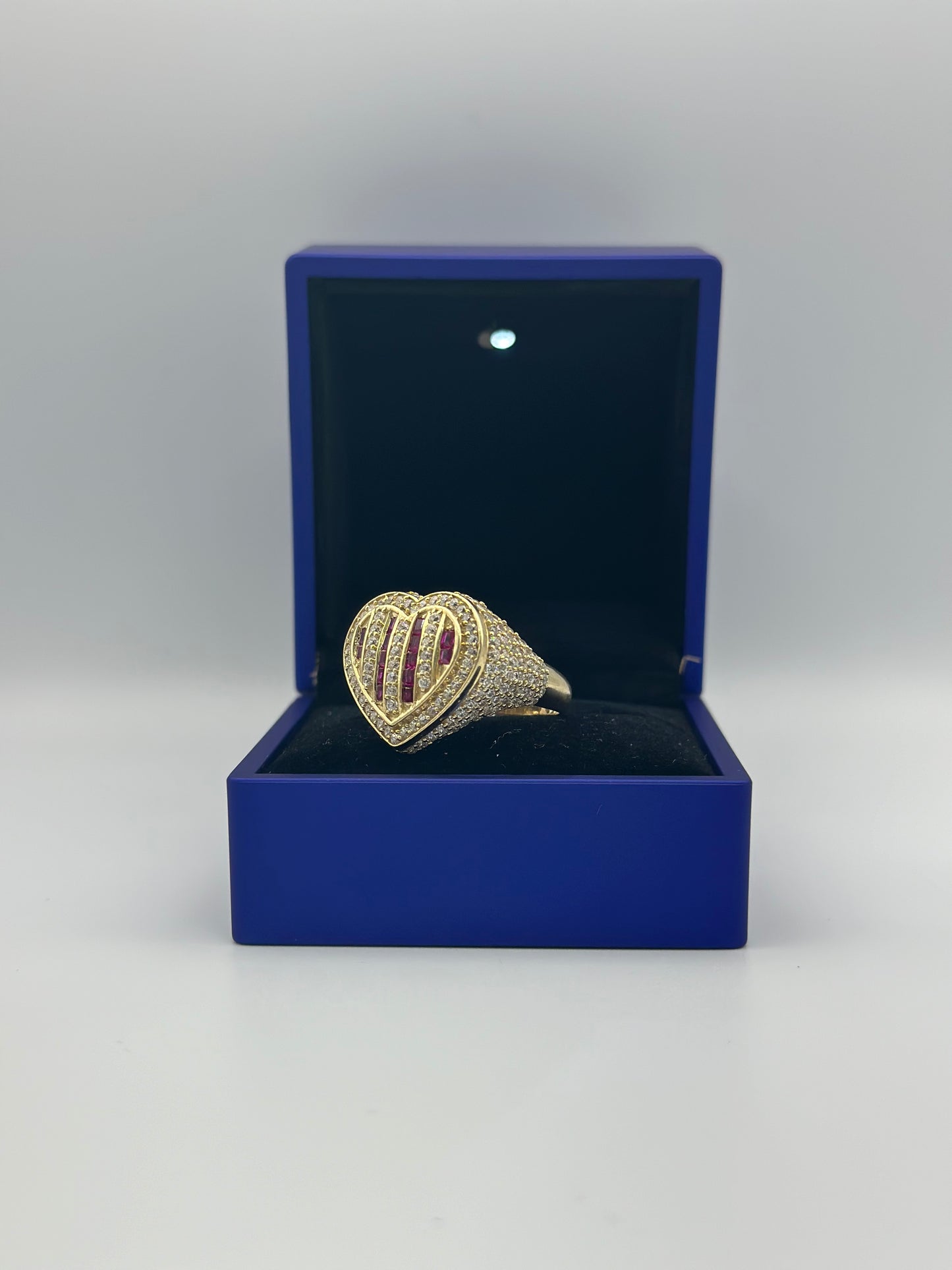 Ring with striped heart design.