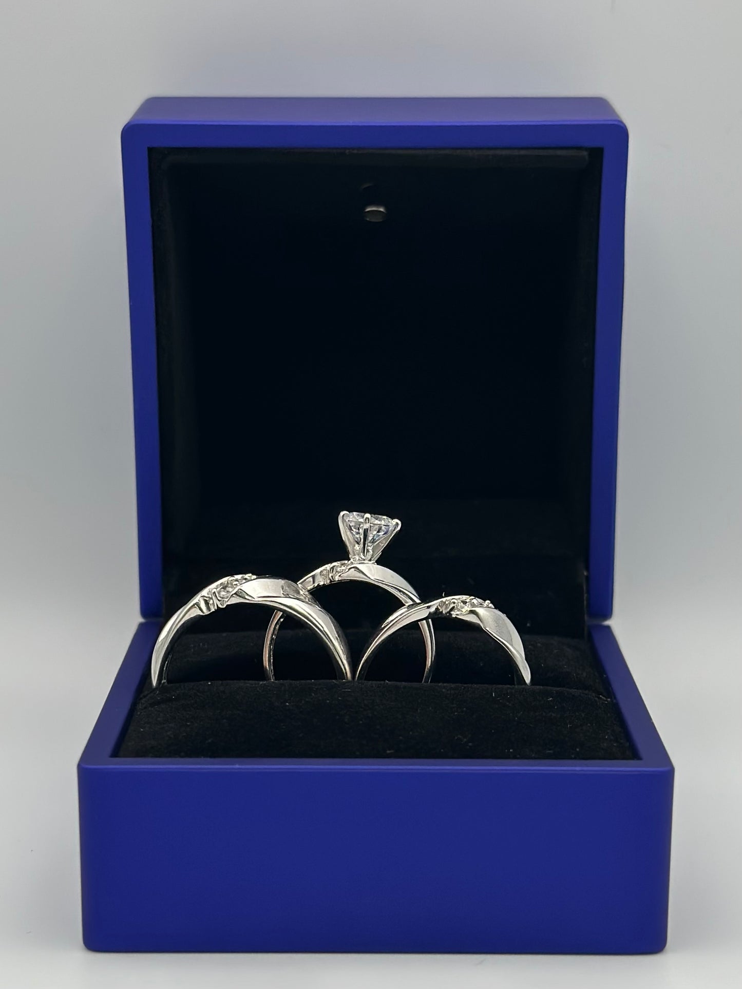 White trio of wedding rings.