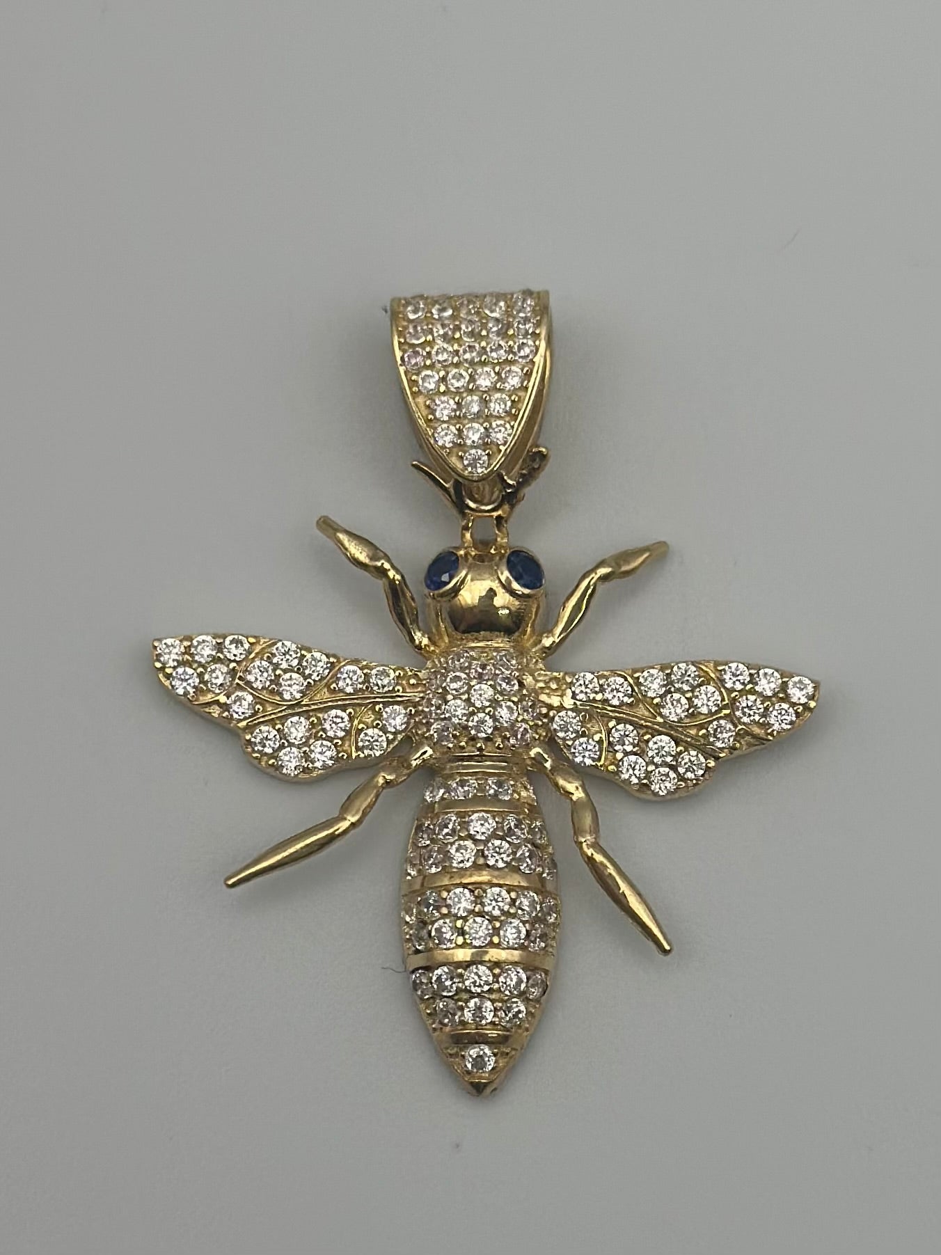 Medal with bee design.