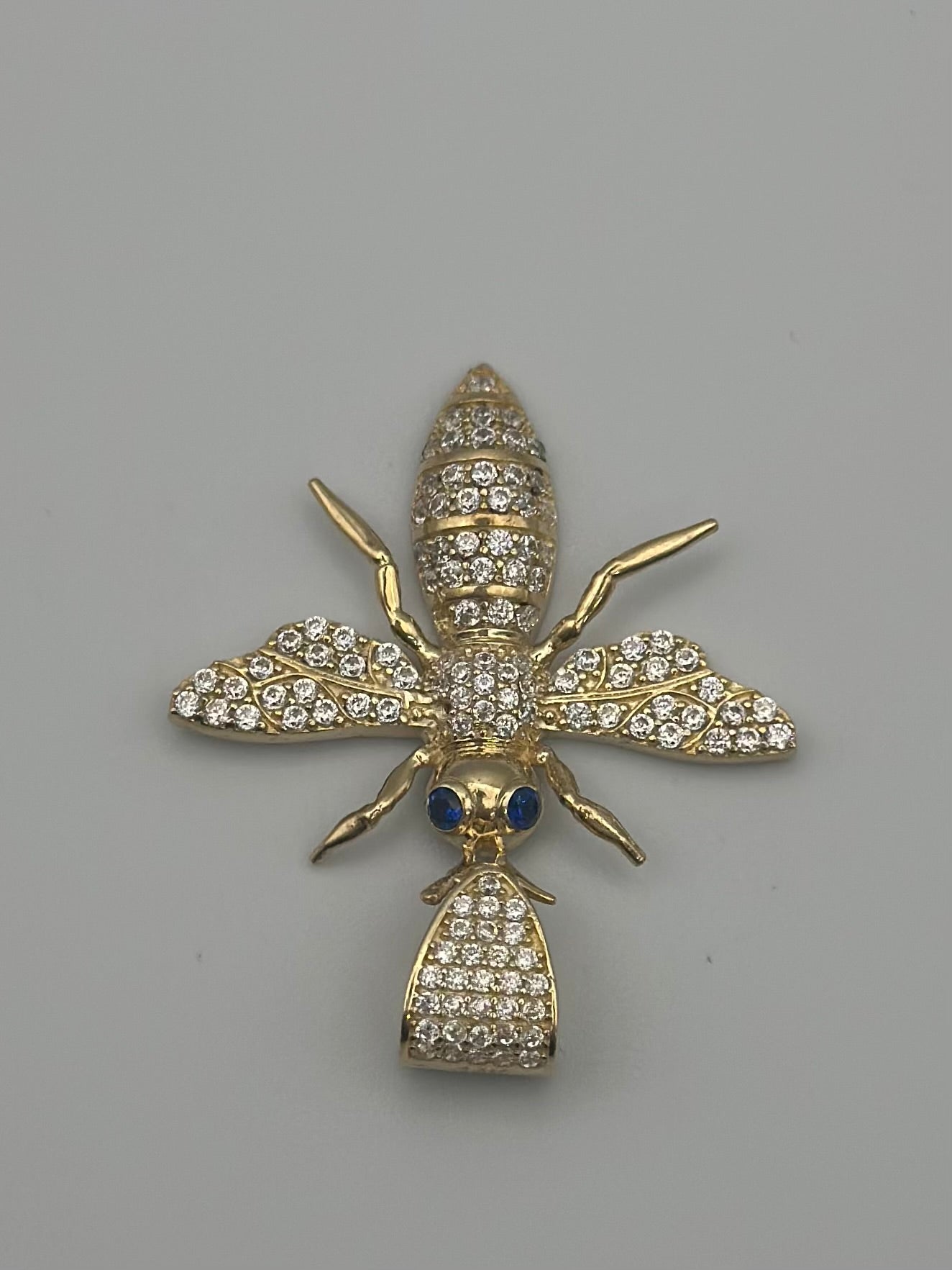 Medal with bee design.