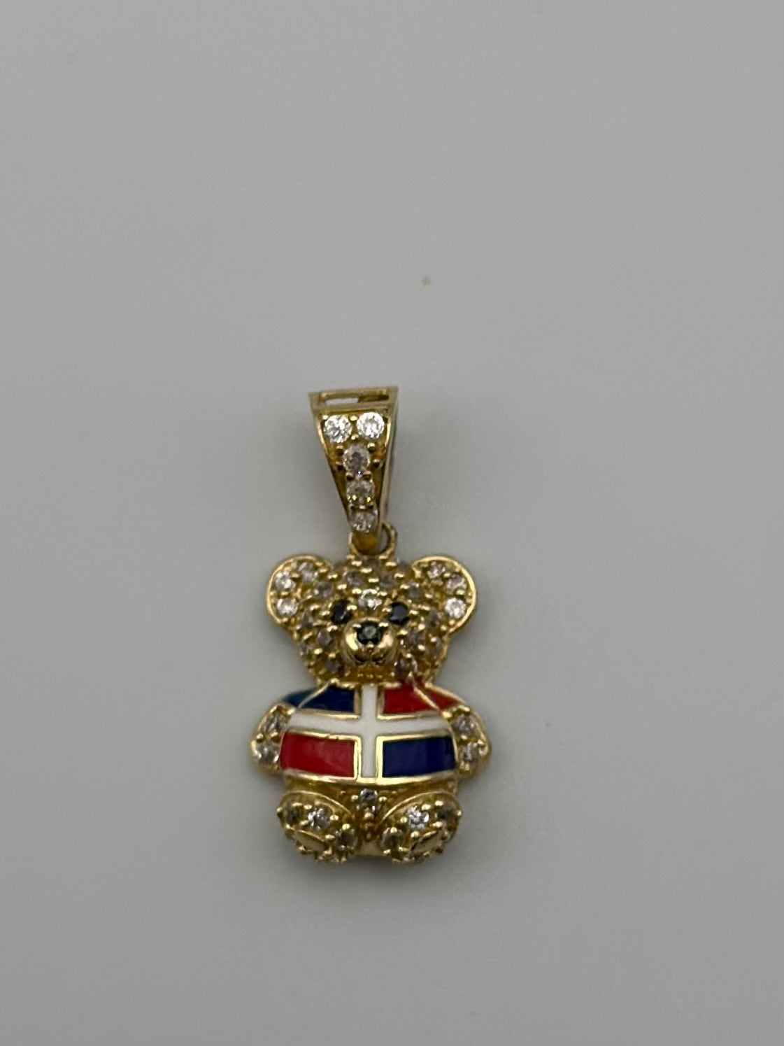 Colorful Dominican bear medal .