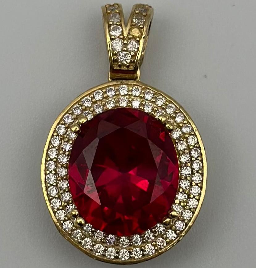 Medal with red zirconia.