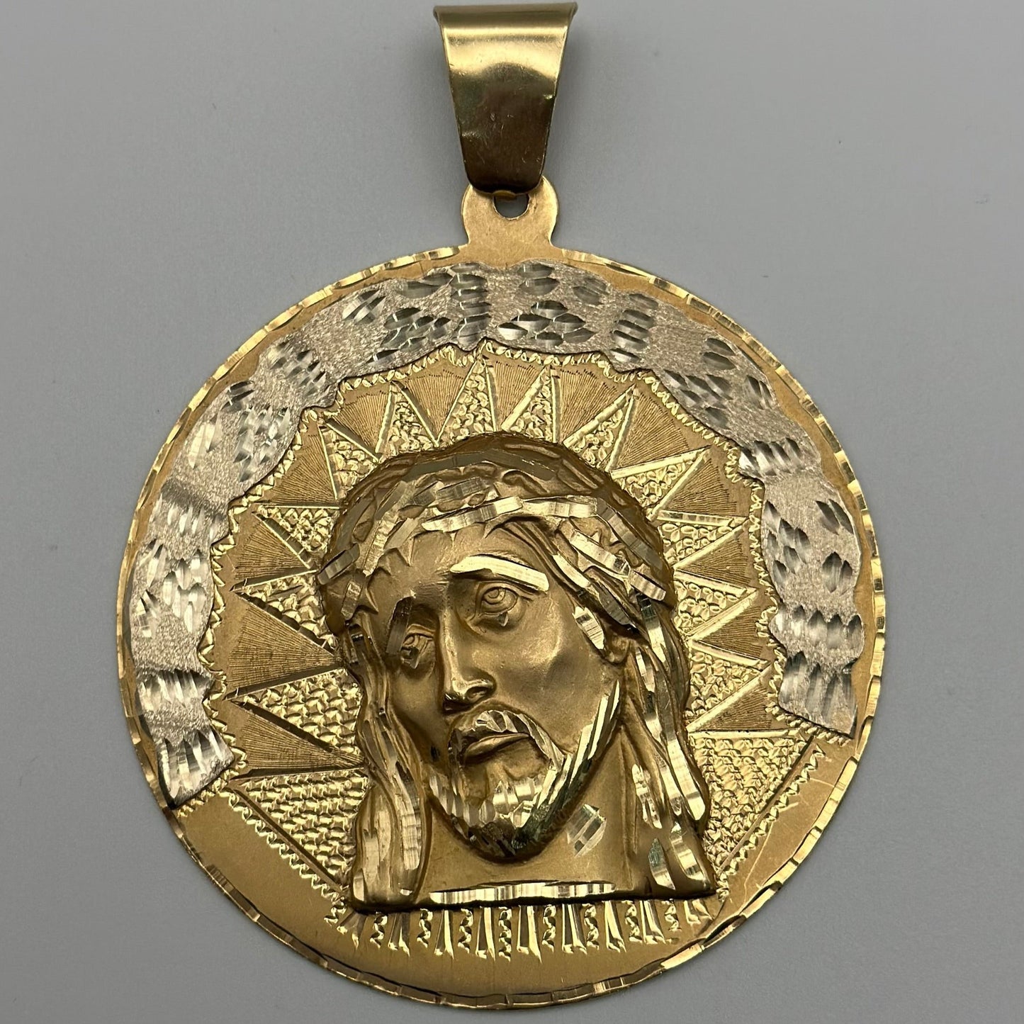 Solid medal with Jesus design.