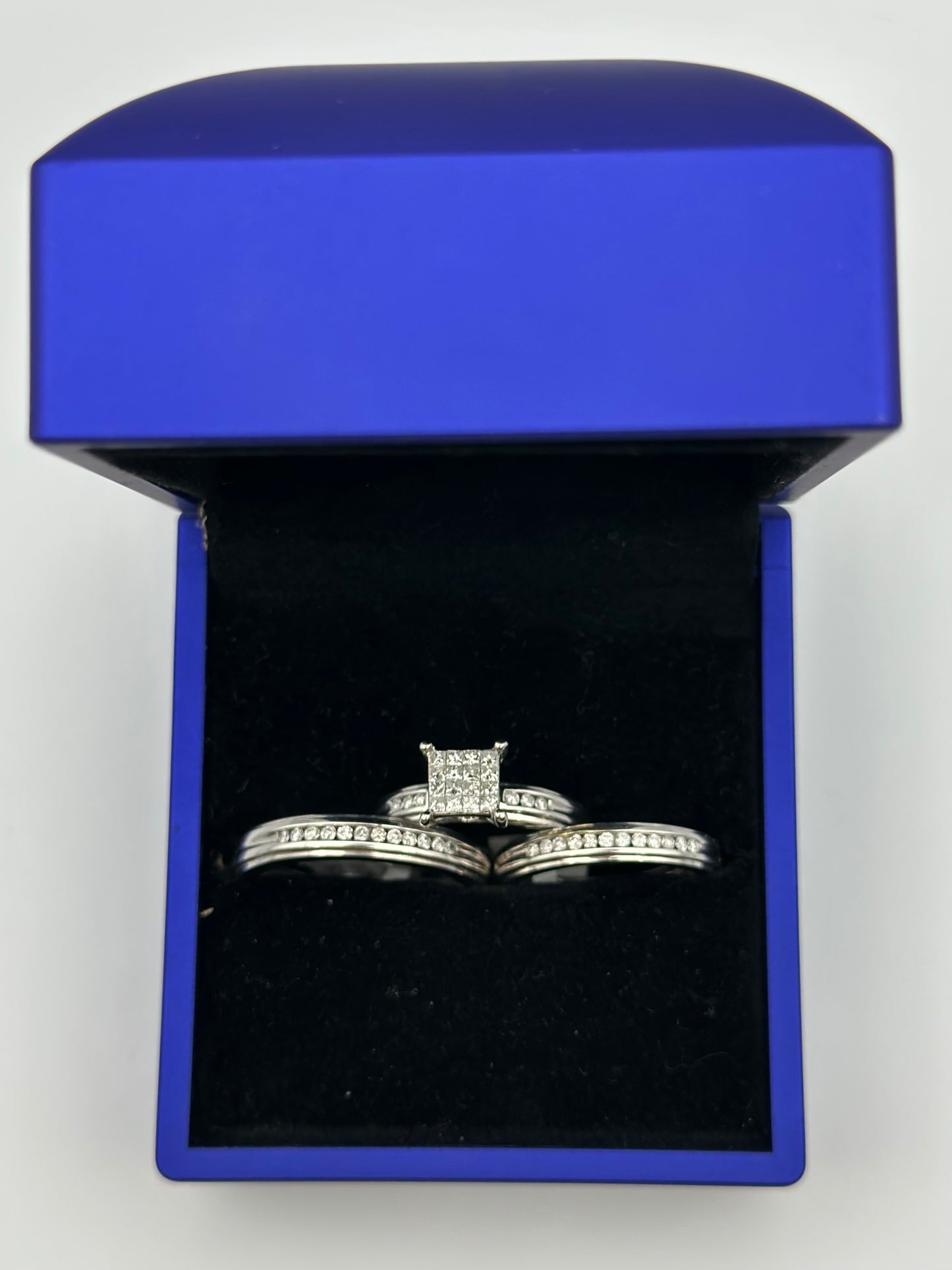 White trio of square diamond wedding ring.